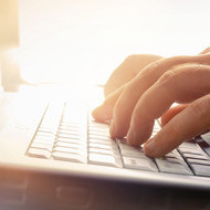 person typing on a keyboard