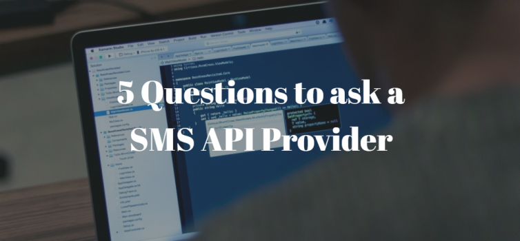 SMS API Provider Questions A photo of a programmer writing code on his lapop. there is white text above it that shows the title: 5 Questions to ask a SMS API Provider